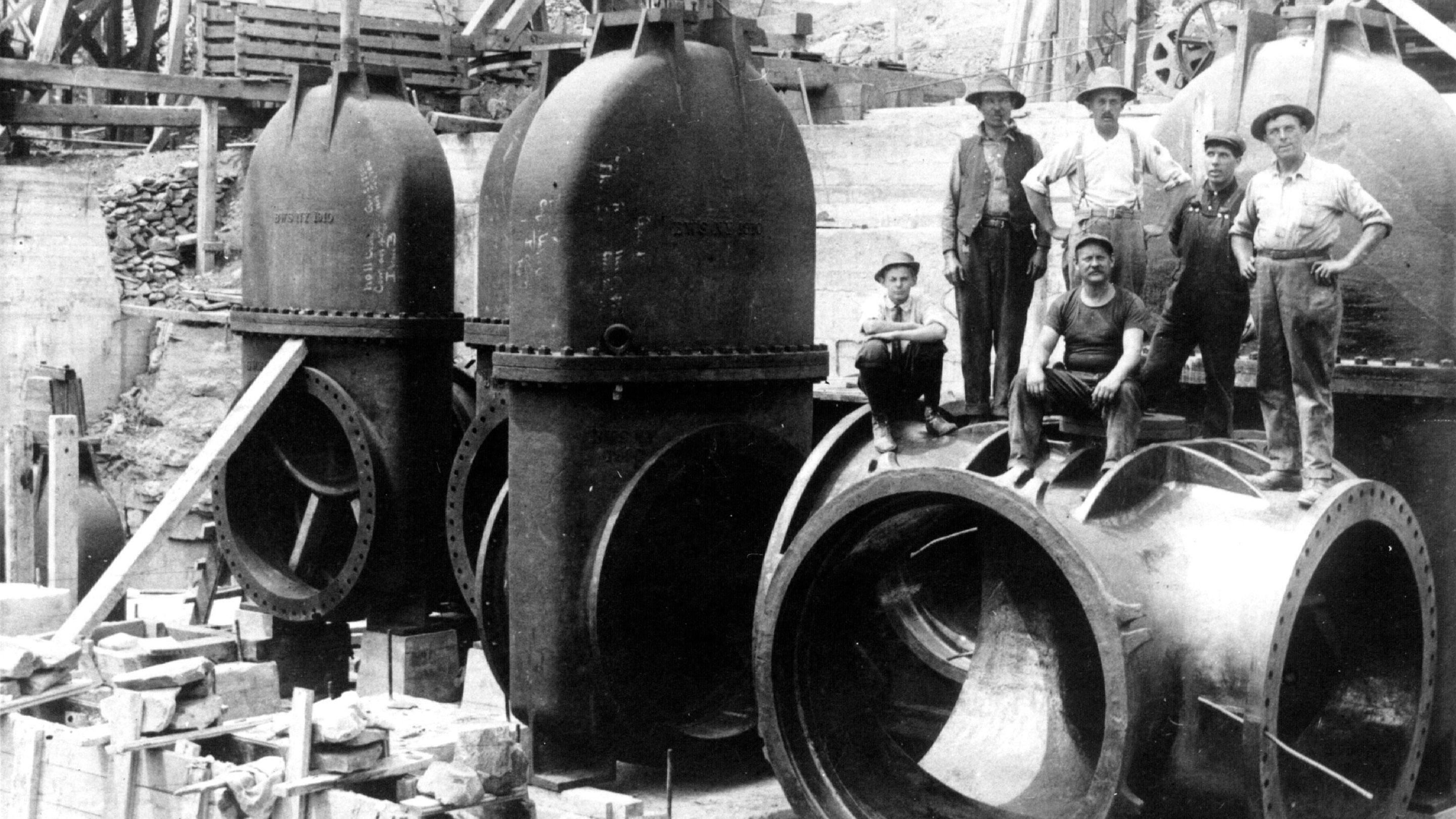 Workers on water pipes during construction of the Catskill Water System, from Deep Water