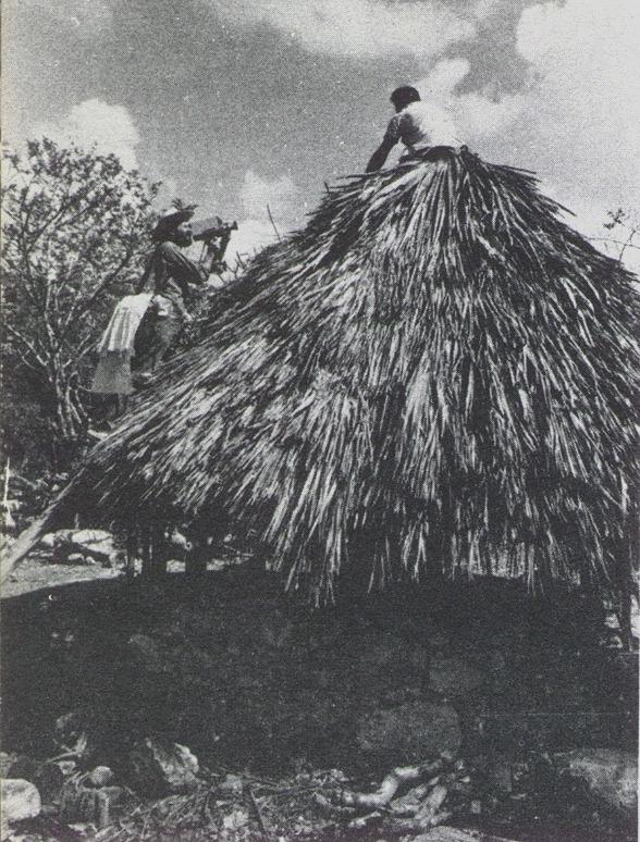 Filming a thatched roof in a Mayan village, from Giving Birth